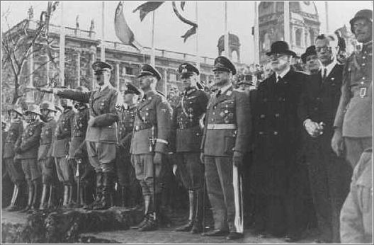 Adolf Hitler and entourage view a military parade following the annexation of Austria (the Anschluss). Vienna, Austria, March 1938